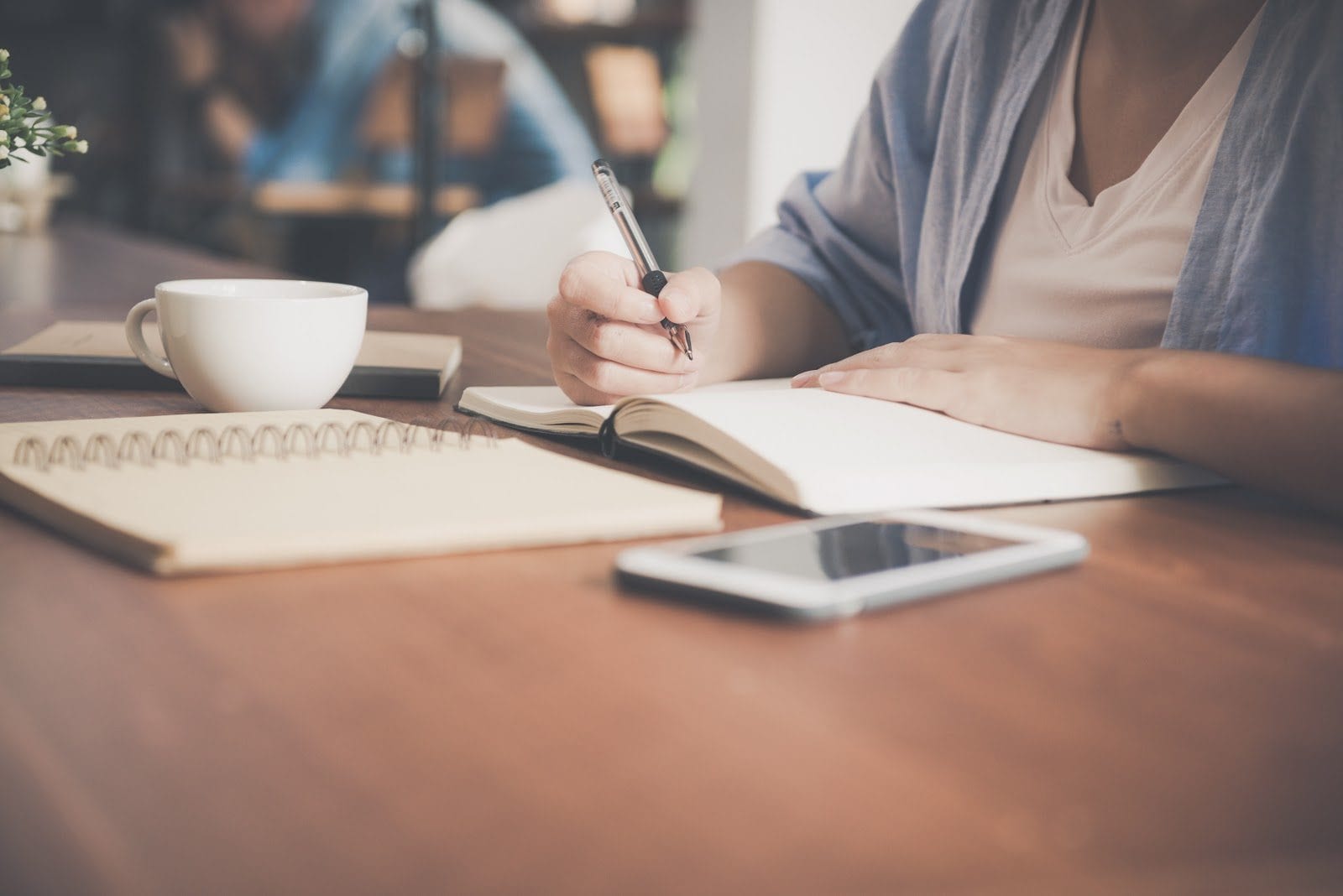 Woman writing in a notebook